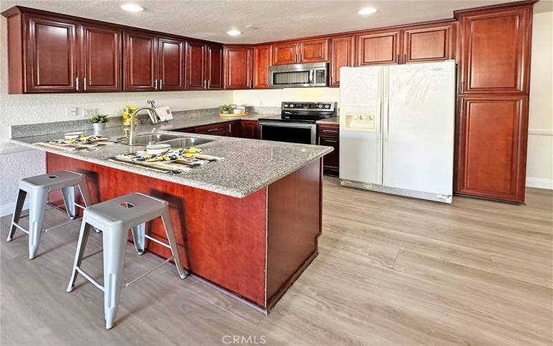 Open concept kitchen with recessed lighting