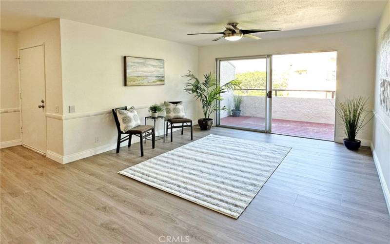 Living room opens to large balcony