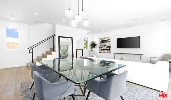 Dining area with contemporary light fixtures