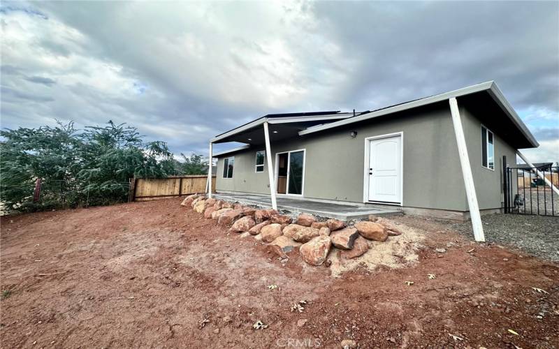 Covered back patio to enjoy the sunsets and views.