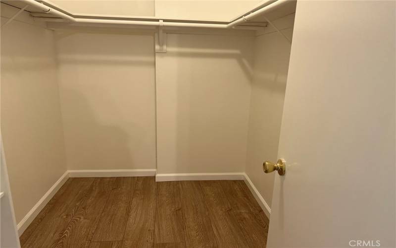 walk in closet in primary bedroom