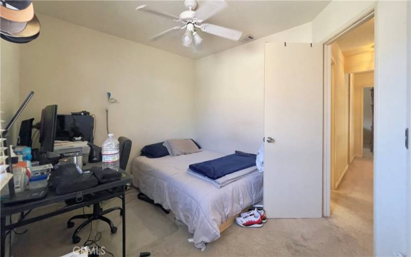 2ND BEDROOM, UPSTAIRS WITH CEILING FAN.