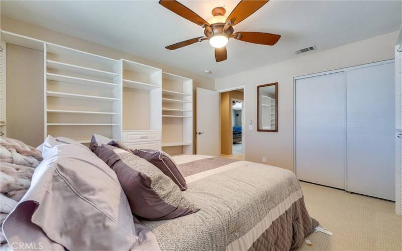 Bedroom 1 with sliding closet and shelves for more storage