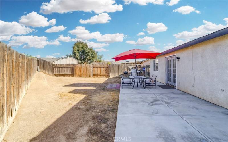 enormous (width of house) uncovered patio. rear yard is a black canvas for you to design.