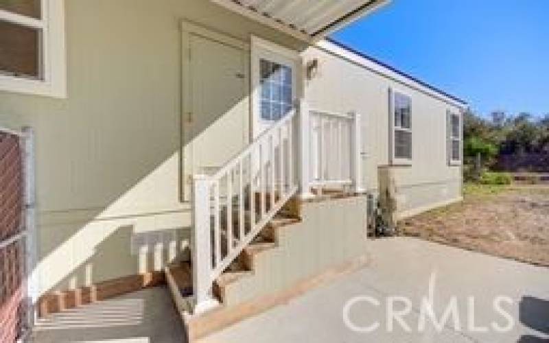 Back stairs to back door and entrance to the laundryroom