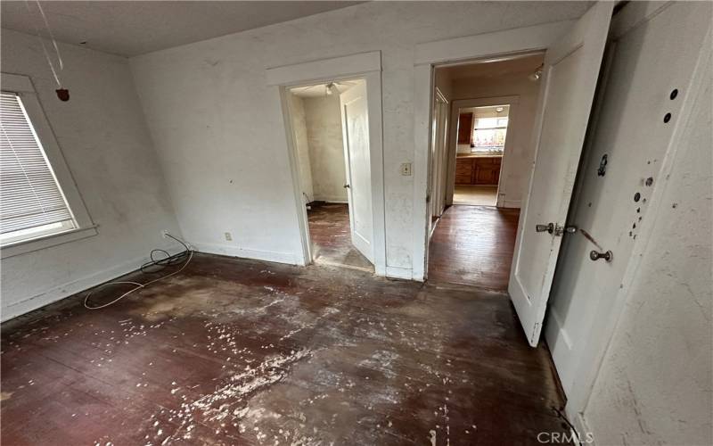 Back bedroom looking to bonus room/nursery  and dining room area.