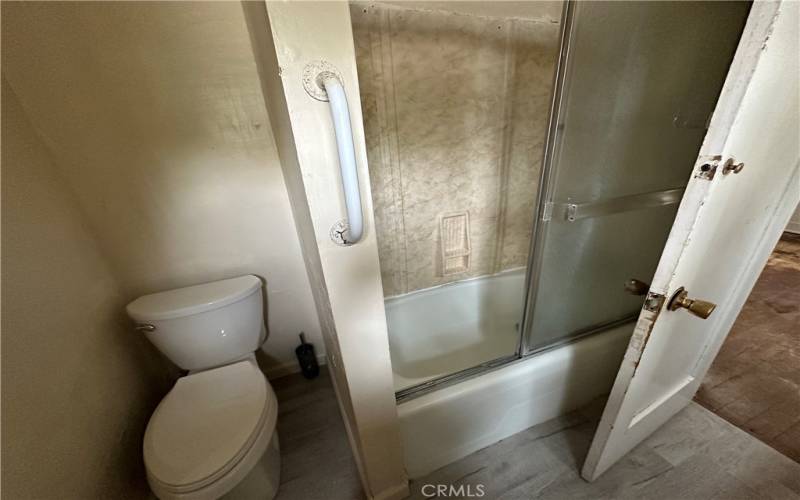 Shower over tub. Jack and Jill bathroom.