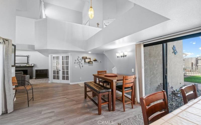 View from the kitchen with sliding door just beyond the breakfast bar that leads to the backyard.