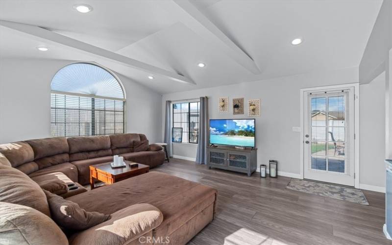 Awesome open-living space with recessed lighting and a patio door to the backyard.  Built in storage to the right of photo (not shown)