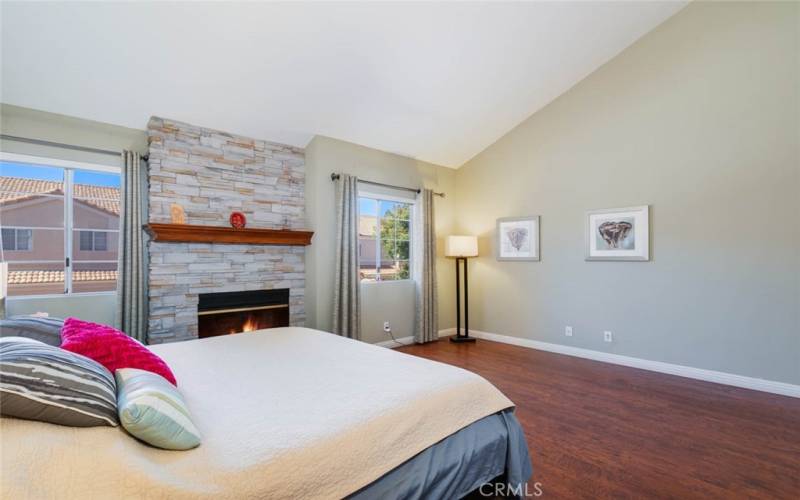 Master suite with vaulted ceilings and fireplace