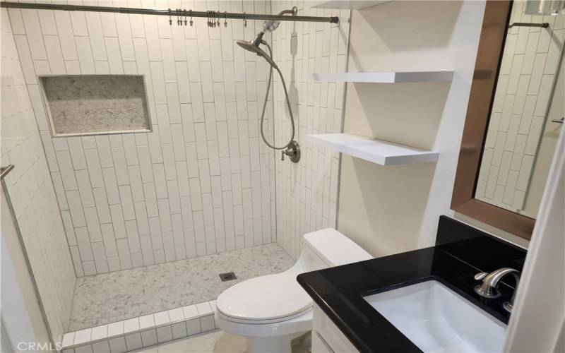 Upgraded Bathroom With Walk In Tile and Granite Sink