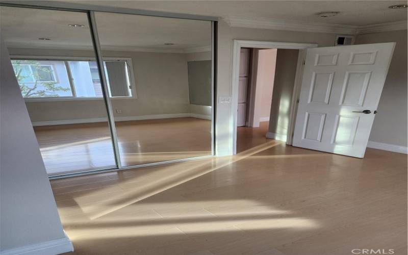 Master Bedroom With Dual Mirrored Glass  Closet Sliders