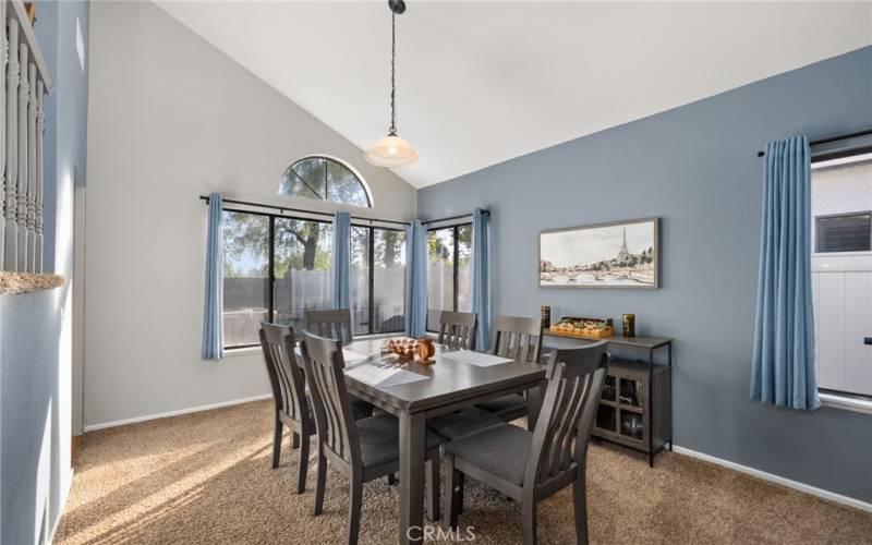 Dining area has corner view of the backyard