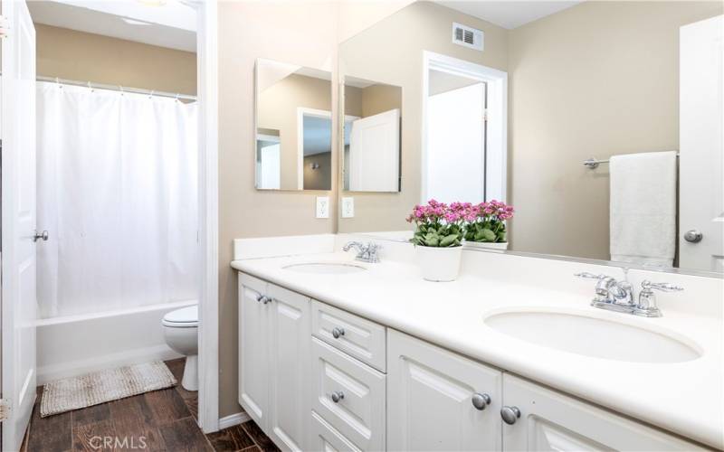 Upstairs bathroom with dual sink vanity