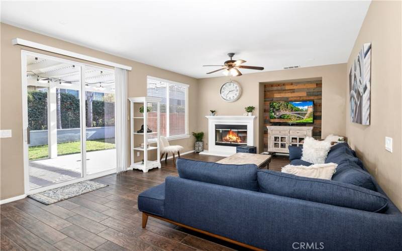 Primary living room with wood burning fireplace