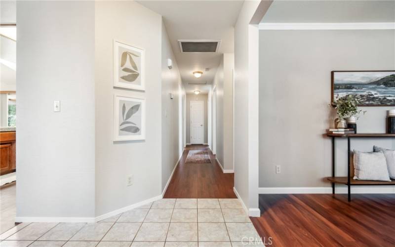 View from the entryway, down the hallway. The room on the right can be used as a living room, office or converted to a 4th bedroom