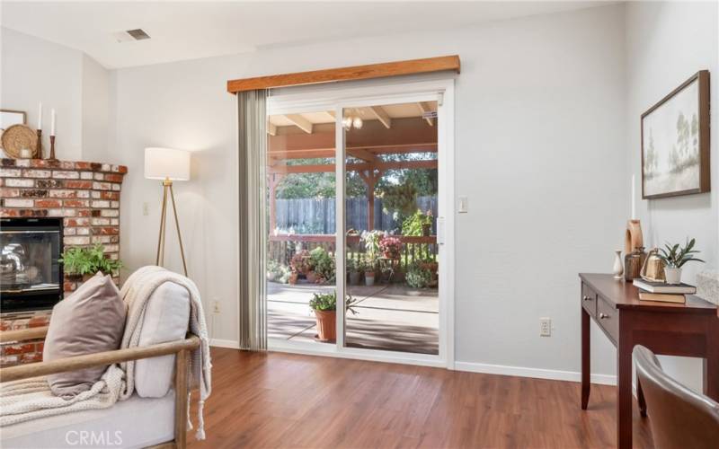 Sliding glass door from the family room to the spacious backyard covered patio