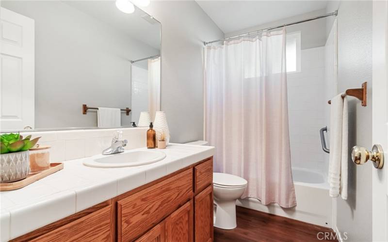 Guest bathroom with tub and shower