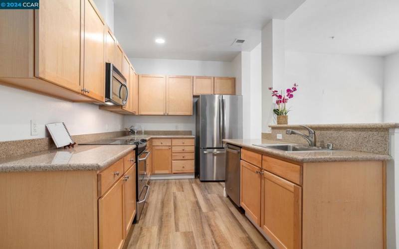 Stainless appliances and lovely granite countertops.