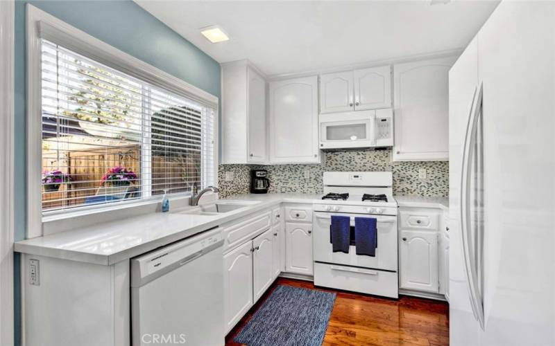 Updated kitchen with Quartz counters and gas stove