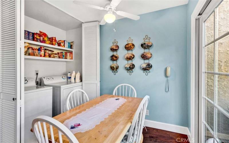 Dining room with laundry in closet and storage