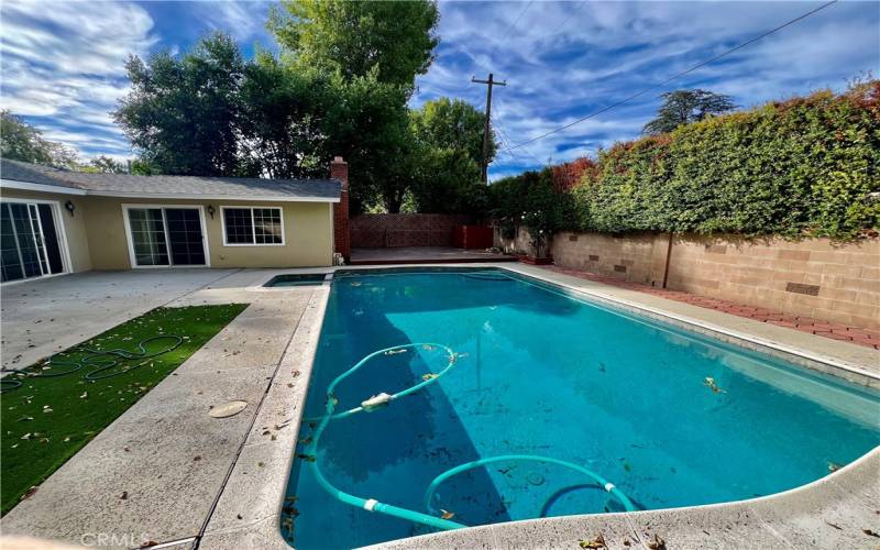 Backyard Pool & Deck area Showing Bedroom 2 access to Backyard and Pool