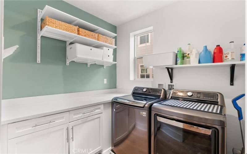 Laundry room next to living room