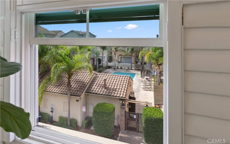 Primary bathroom has a view of the pool