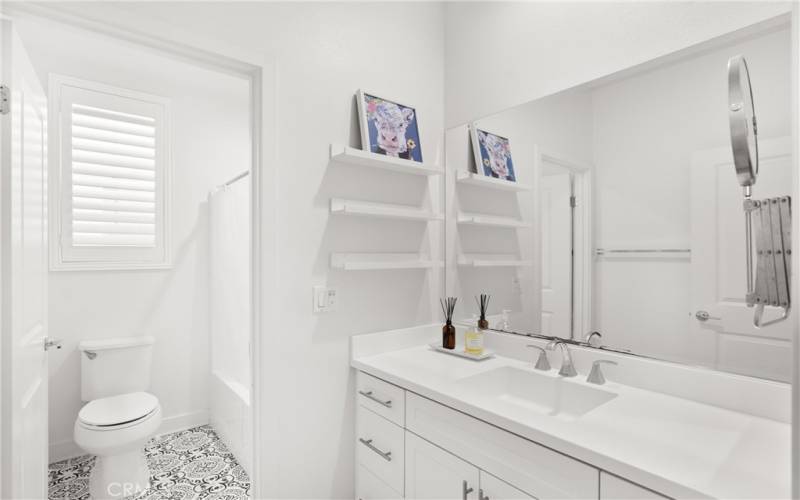 Hallway bathroom with shower and bathtub on the 2nd floor across from the laundry room.