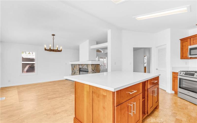 Nice architectural features and ceiling lines. The island has some open shelving for your cookbooks or store a blender and toaster there.