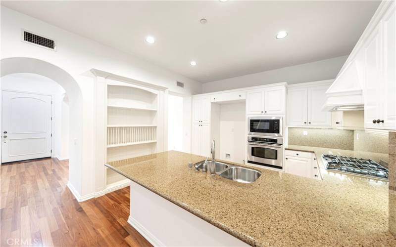 Kitchen with stainless steel appliances and breakfast bar