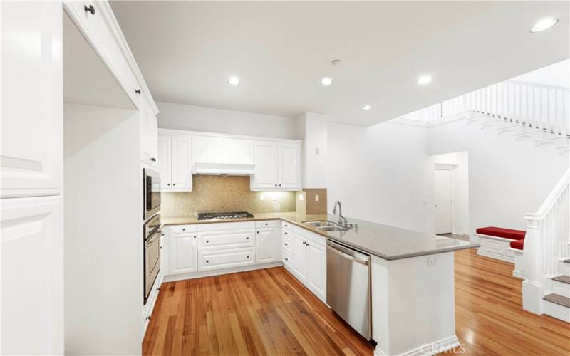 Kitchen with stainless steel appliances and breakfast bar