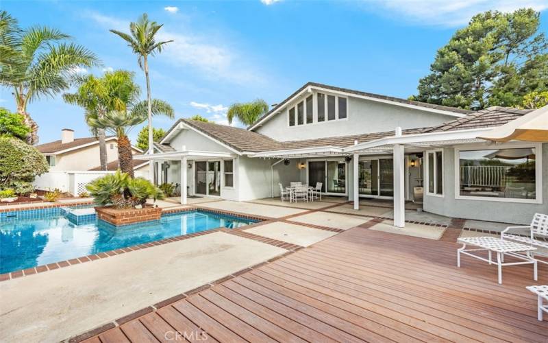 Backyard with pool and decking.