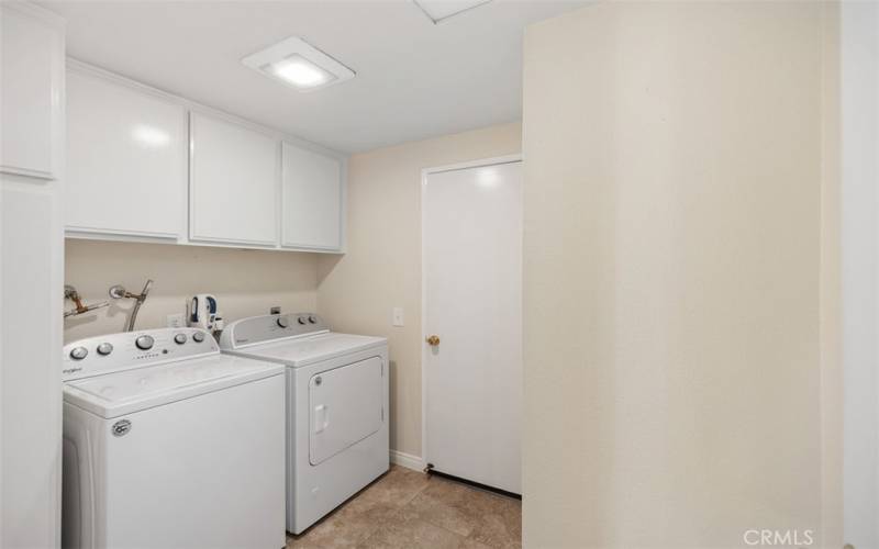 Inside laundry room. Washer and dryer are included.