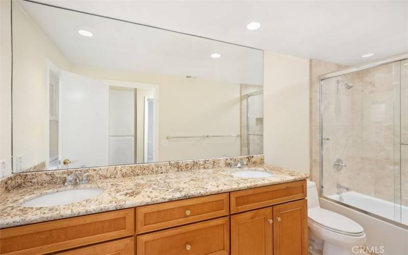 Guest bathroom #1 with a dual vanity.