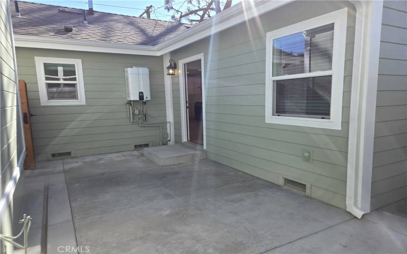 Private side patio has access to the house.