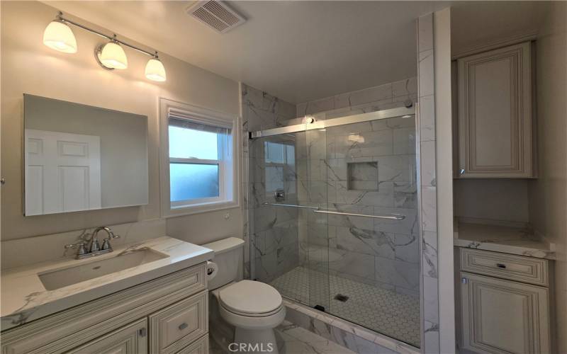 Storage galore in this brand new bathroom. Wonderful natural light and incredibly thoughtful detail.