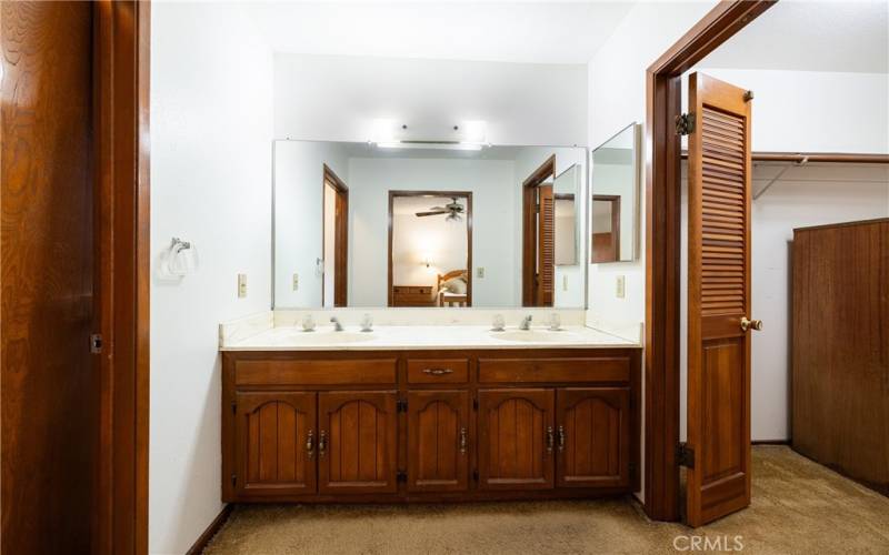 Vanity Area with Access to Walk-in Closet and Bathroom