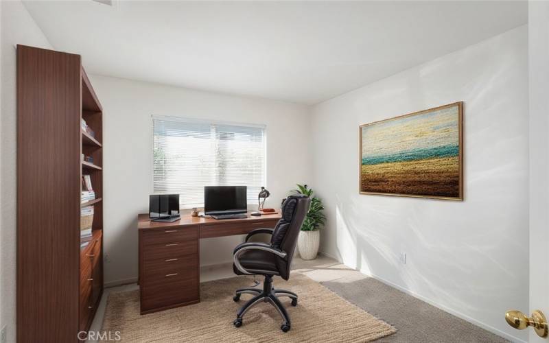 Versatile room with soft carpeting and natural light, perfect for a cozy bedroom or productive home office.











