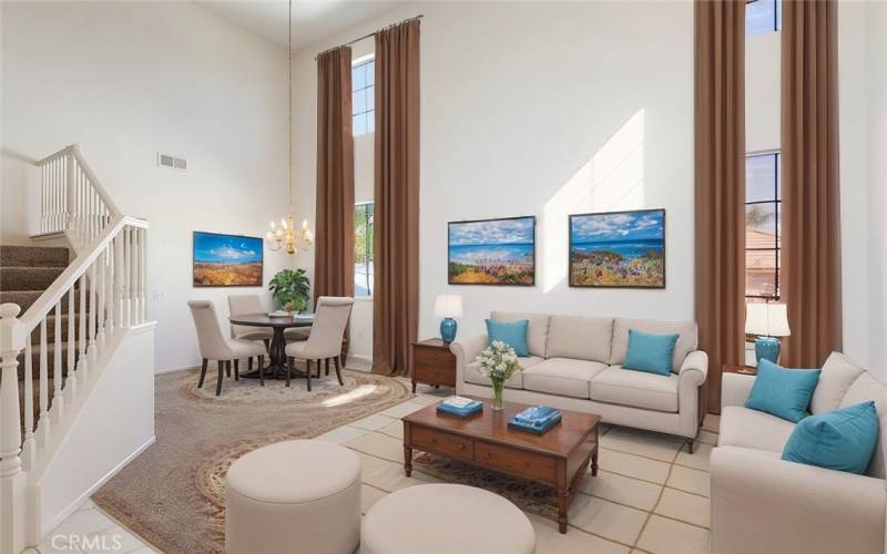 Spacious living room with soaring ceilings, tons of natural light, and a bright open layout.