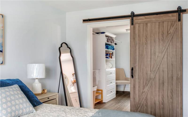 master bedroom closet door and entrance to bathroom