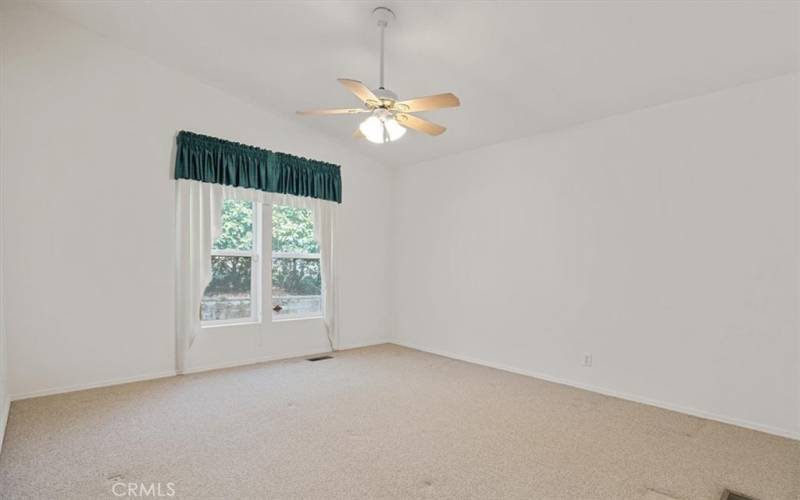 Bedroom #2 is generously sized and features a walk in closet and built in shelves