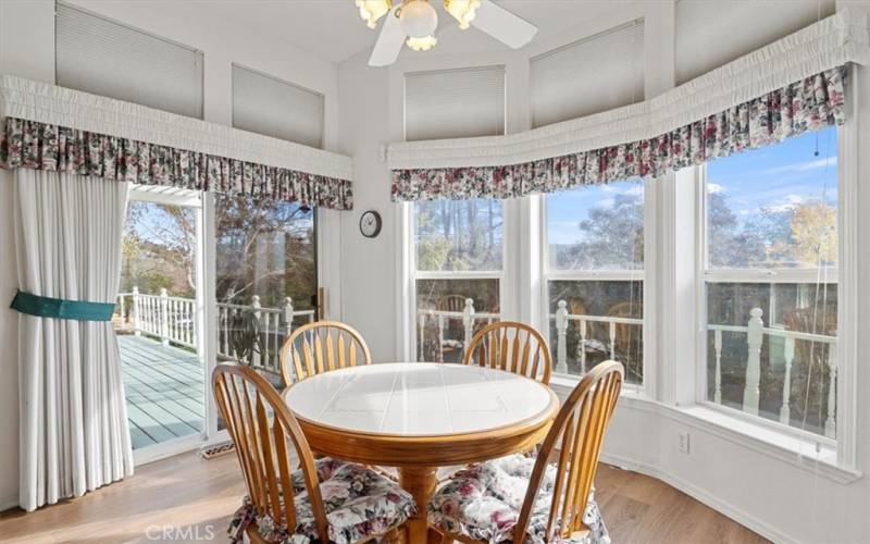 Breakfast nook with lots of natural light and access to deck