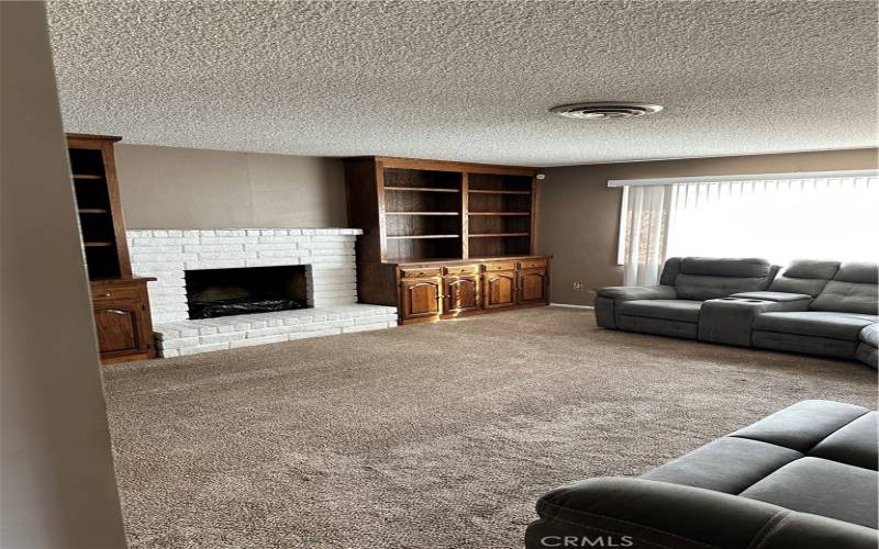 Family Room with fireplace and built in bookcases