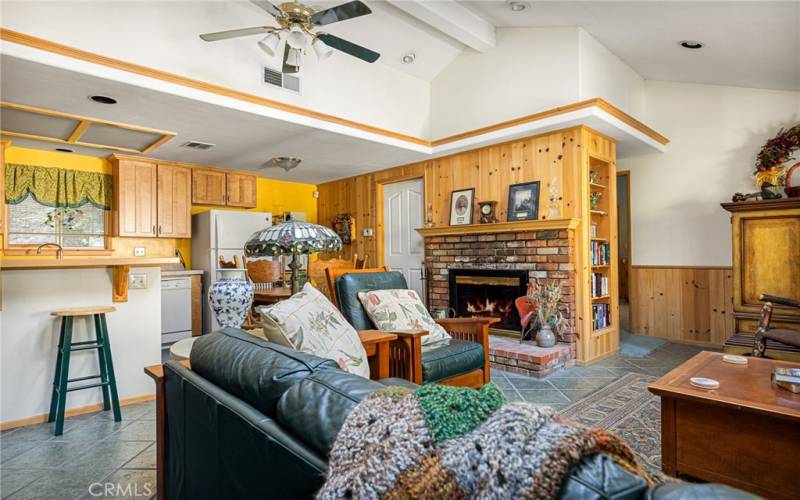 Living room and dining with fireplace.