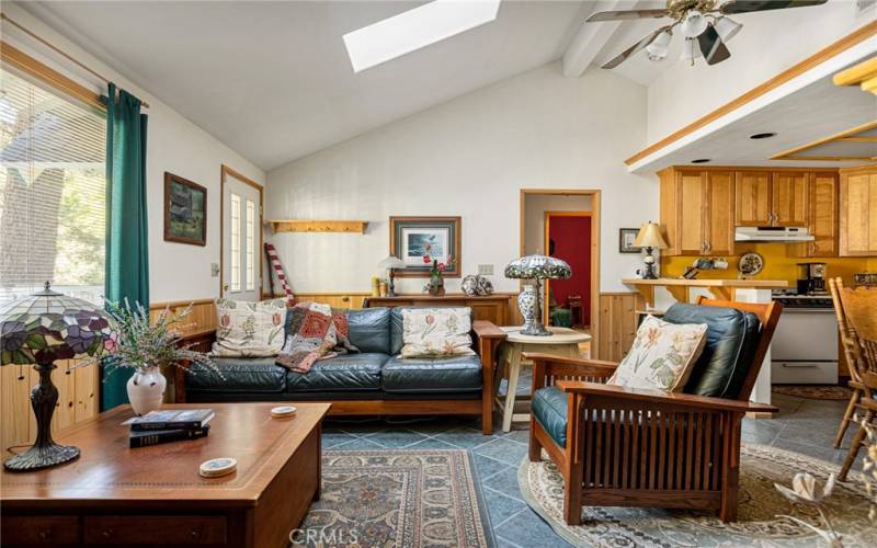 Living room open to kitchen and dining.