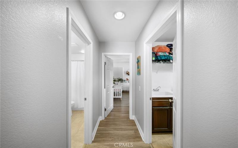 Hallway to additional bathroom and bedrooms