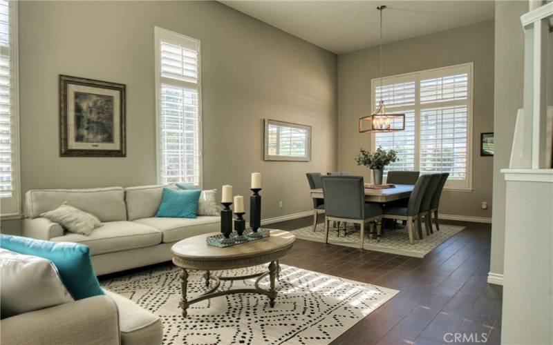 living room/dining room with vaulted ceilings