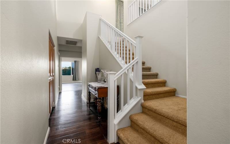 Staircase up to loft and full bathroom