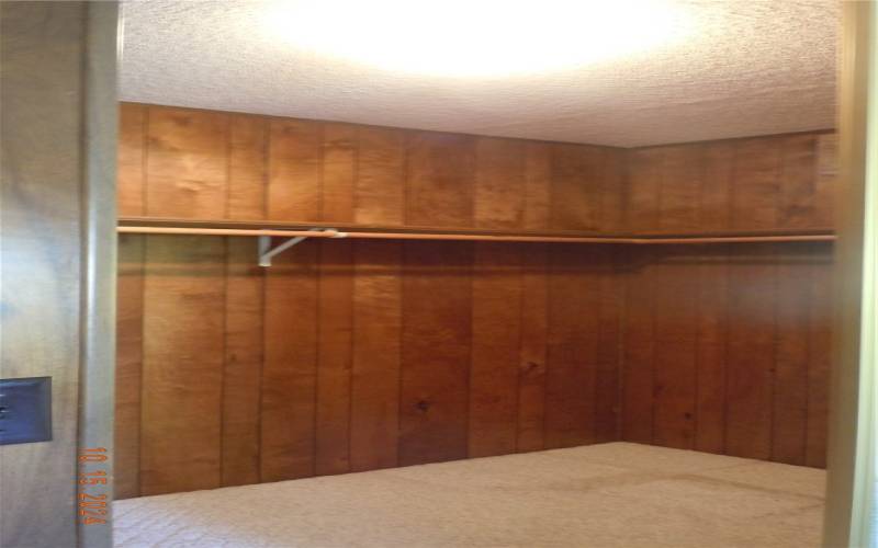 Primary bedroom walk-in closet.